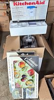 KitchenAid pasta drying rack box, food processor parts inside shipping box, Instant Counter burner cover boxes