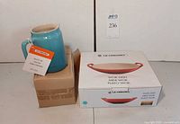 Le Creuset sauce jar with hang tag and boxed wok dish