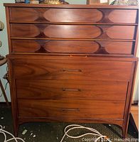 Front view of Kent Coffey Perspecta tall dresser showing six drawers and sculpted pulls