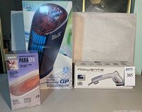 Boxed Sharper Image Ionic Breeze GP purifier, HoMedics ParaSpa wax refill box, Rowenta UltraSteam box