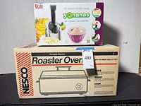 Nesco roaster oven box stacked with Yonanas dessert maker box