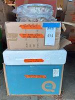 Stacked lot showing boxed Temp-tations baker, oval platters and bowls