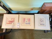 Front view showing all three matted prints with different frame colors