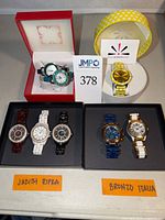 Group shot showing all eight watches arranged by brand
