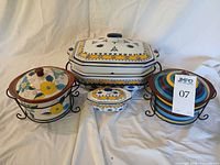 Group view of all ceramic cookware and racks