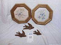 Lot overview showing both framed prints and three plastic birds