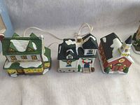 All three ceramic village houses connected by power cord