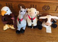 group shot of all four Coca-Cola plush animals