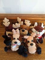 Group shot of all five Coca-Cola holiday mini plush toys