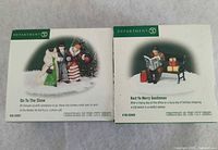 Both boxed figurine sets side by side