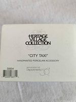 Box showing Heritage Village Collection City Taxi labeling