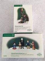 Front of both boxed figurine sets