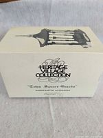 Front of original Heritage Village Collection box
