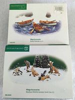 Front of both Department 56 boxes showing product titles and artwork