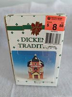 front of boxed Dickens Traditions Candy Shop lighted building