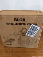 Front of box showing GLOIL branding, model HY-301 line drawing of steam cleaner