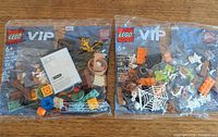Front view of both sealed LEGO VIP Add-On Pack polybags