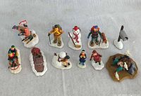 Full group shot of all 11 figurines on tabletop