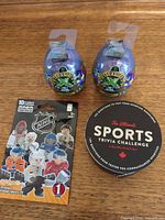 Group shot showing 2 Treasure X Alien eggs, OYO Sports NHL blind pack, Sports Trivia Challenge card box