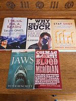 All five books front covers visible