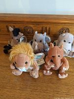 Group shot showing all five Coca-Cola plush animals