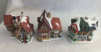 Front view of all three ceramic Christmas village buildings