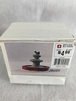 Box showing image of fountain and White Rose W.H. Perron label