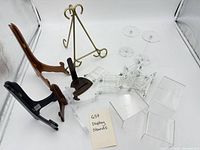 Group view of assorted display stands on white backdrop