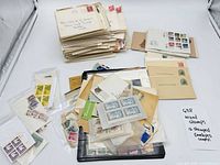 Overview of loose stamps, stamped envelopes and postcards