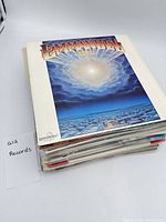 Front view of stack showing Emmanuel album cover on top