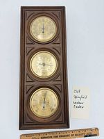 Full view of wood plaque with three brass dials