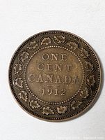 Reverse showing ONE CENT CANADA 1912 within maple leaf wreath