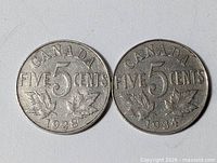 Both coins reverse side showing CANADA FIVE CENTS, dates 1928 and 1934