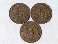 Three 1932 Canada one-cent coins reverse side view
