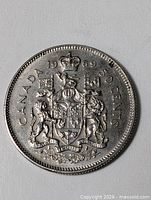 Reverse of 1969 Canadian 50-cent coin showing coat of arms