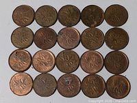 20 Canadian pennies arranged in four rows of five