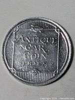 Obverse view of Sunoco Antique Car Coin token showing full design and text