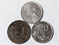 Group shot of all three coins: UK 10p, East Caribbean 2c, Australia 20c