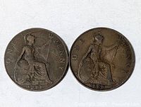 Two UK one penny coins 1911 and 1921 reverse side