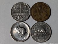 Group shot of four Canadian 5 cent coins showing obverse designs