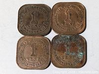 Fronts of four square 1 cent coins showing denomination and dates 1957, 1945, 1943 (two)