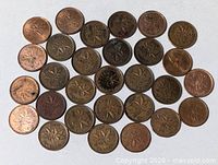 Full group of Canadian one-cent coins laid out flat