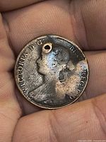 Obverse showing Queen Victoria bust, perforation, wear