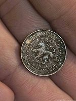 Obverse showing rampant lion, legend and 1905 date