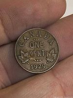 Reverse side of 1929 Canada one cent coin showing CANADA ONE CENT 1929 and maple leaves