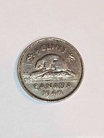 Reverse of 1940 Canada 5-cent coin showing beaver design and denomination