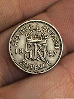 Reverse of 1947 sixpence showing crowned monogram and date