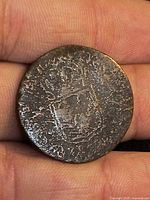 Obverse showing faint crowned shield design