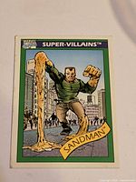Front of Sandman Super-Villains trading card showing illustration and title