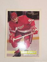 Front view of Topps Premier Hockey card with player image and text
